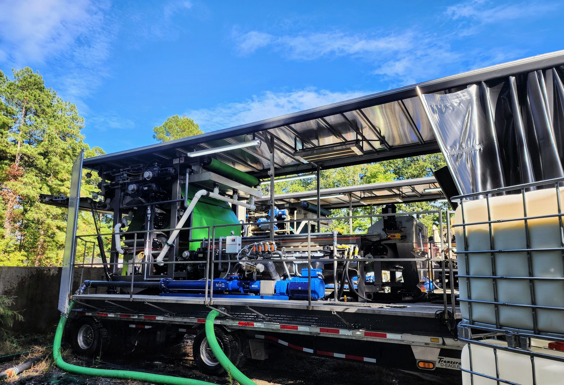 The mobile belt press set up on a job site