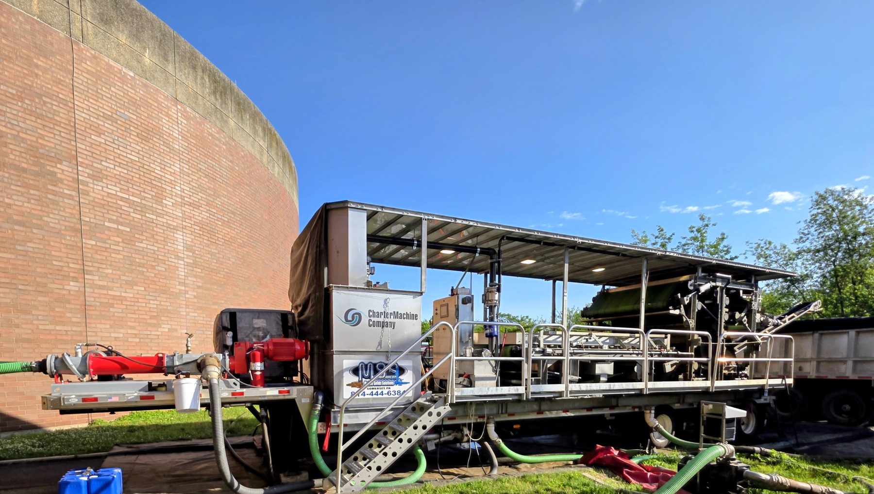 Mixing tank and sealed roll-offs staged at a Philadelphia job