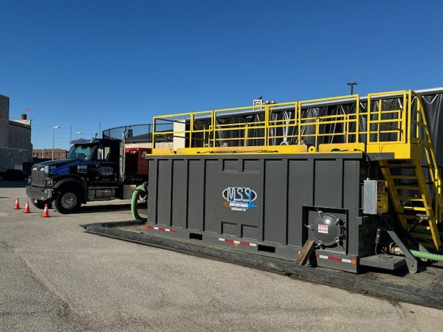 Mobile Solids Solutions mixing tank and tractor staged at Fort Wayne Water Pollution Control Plant