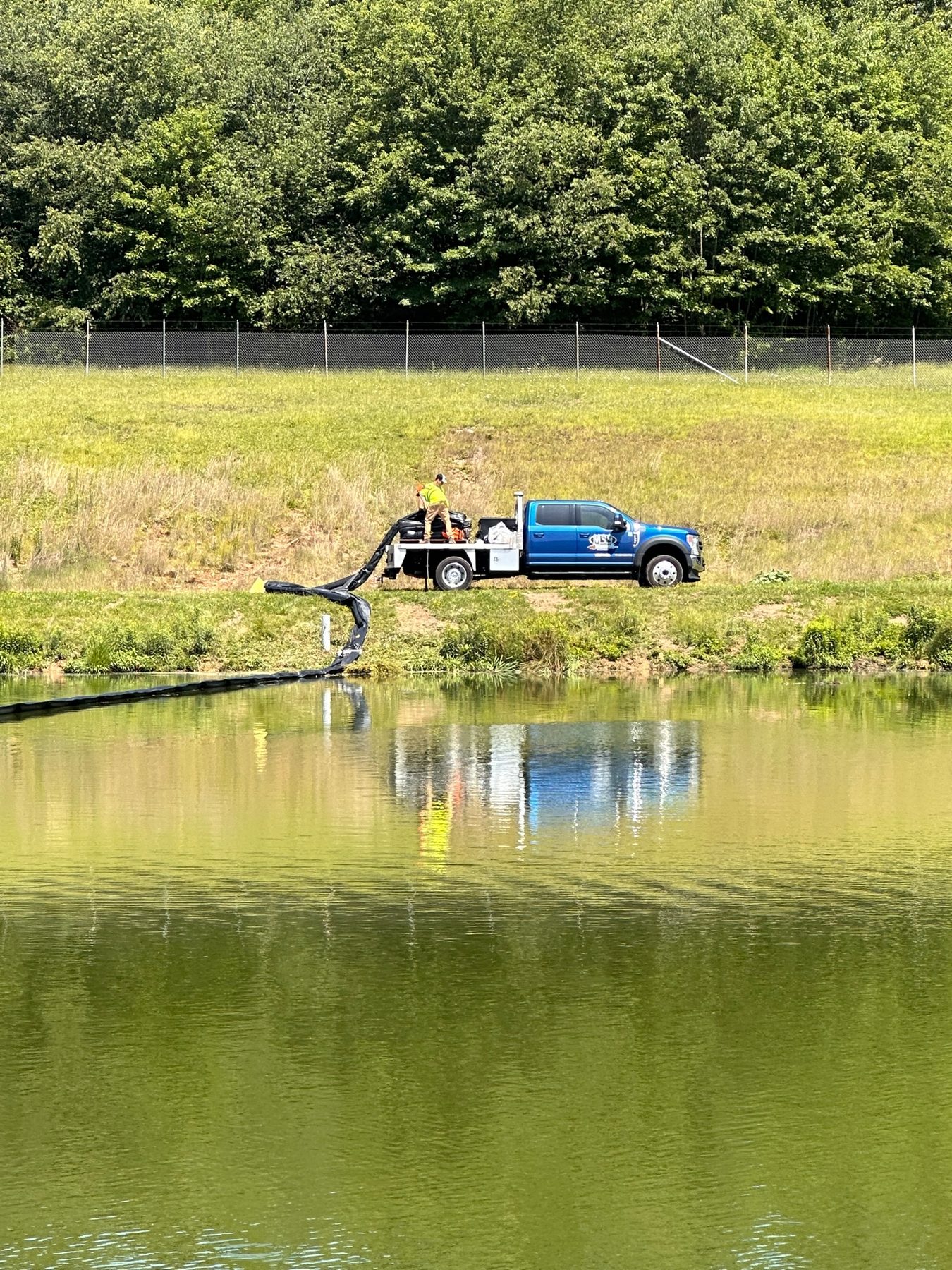 Aerial view of lagoon sludge removal and baffle installation at Strattanville, Pennsylvania