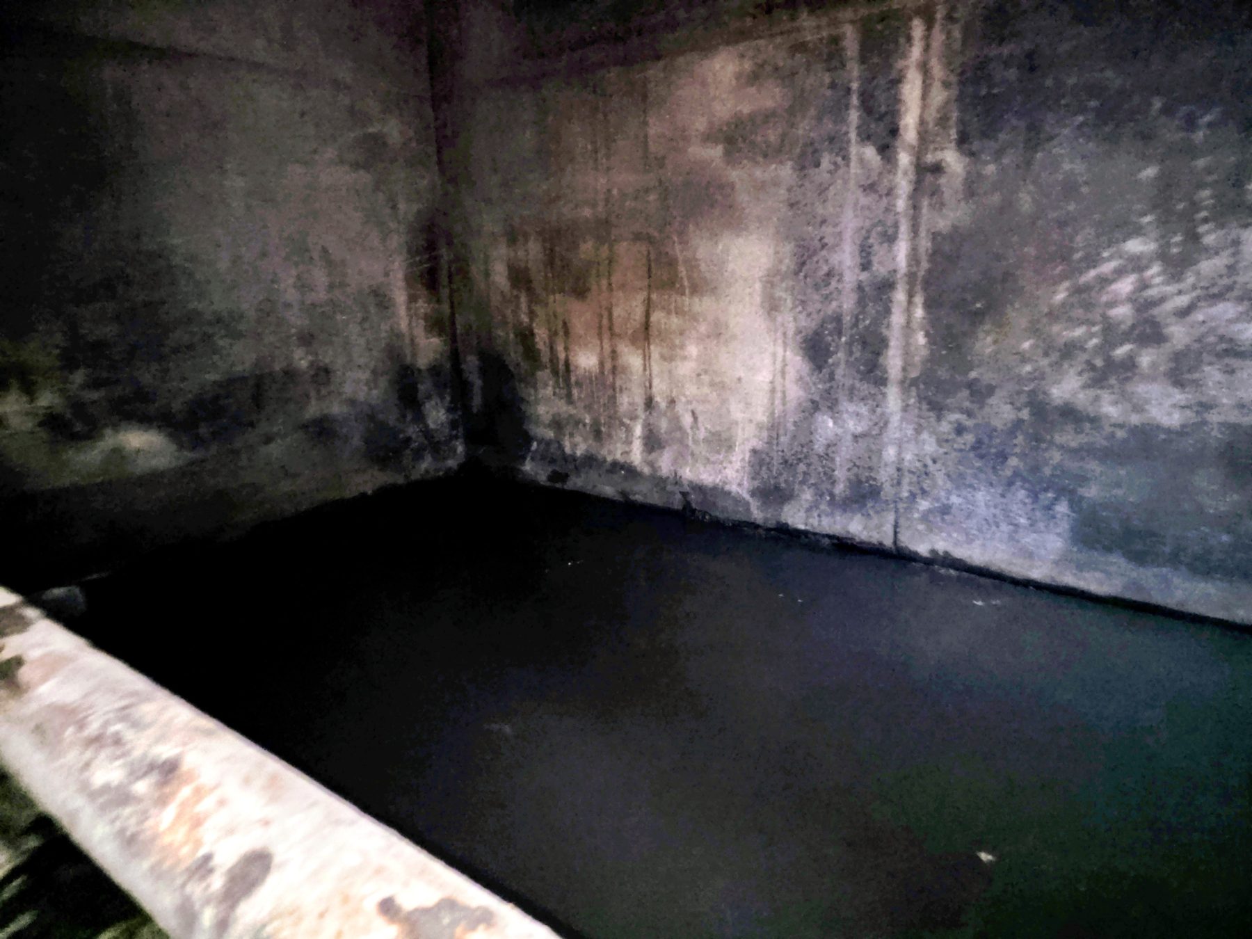Interior of a rectangular treatment tank during cleaning at Towanda WWTP