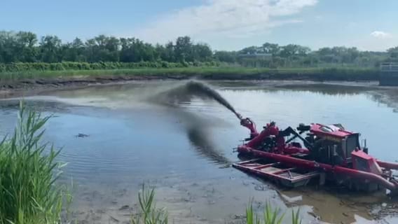 The Lagoon Crawler working a municipal lagoon